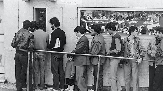 Audiences in Tehran queuing outside a cinema before the 1979 Revolution.